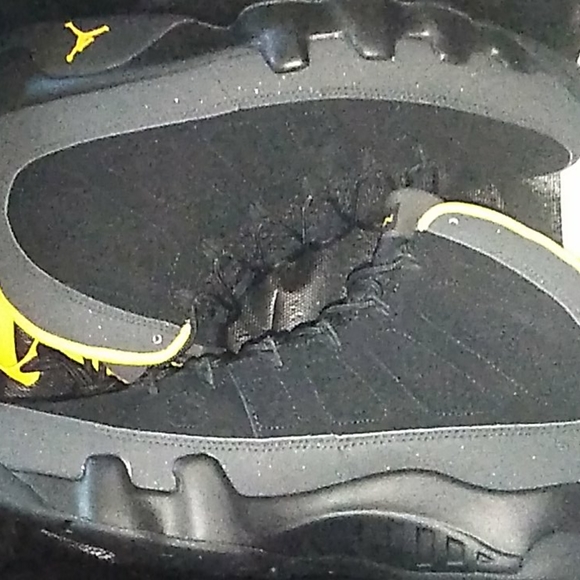black and university gold jordan 9s